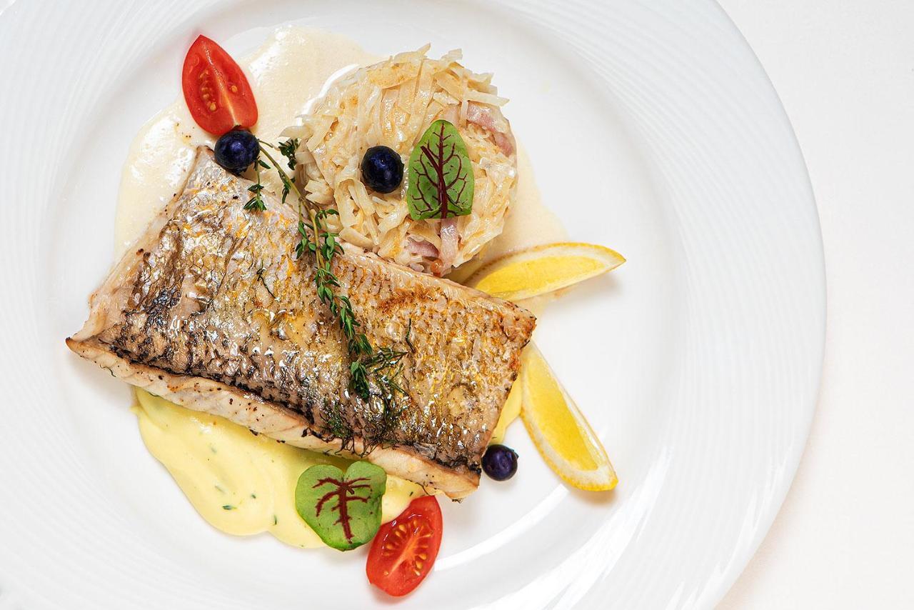 Boutique Odyseja & Spa Ciechocinek Buitenkant foto A prepared dish of Arctic char